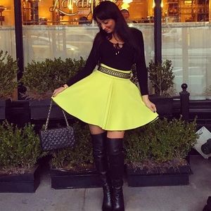 Yellow A line pleated flared skirt w chain belt